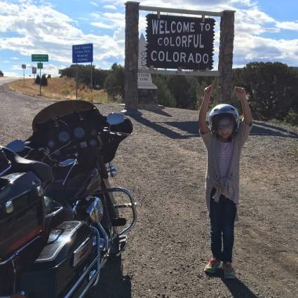 Someone is excited to be in Colorado. It's her first time in this state and her 5th state to reach on a motorcycle.